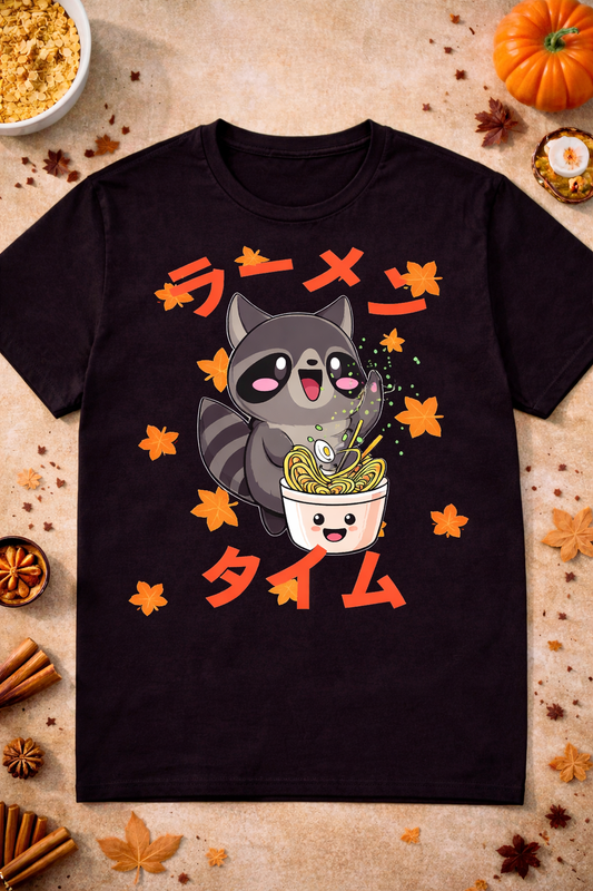 Black kawaii raccoon ramen graphic t shirt with cute anime design and autumn leaves flatlay, Japanese foodie shirt for ramen lovers