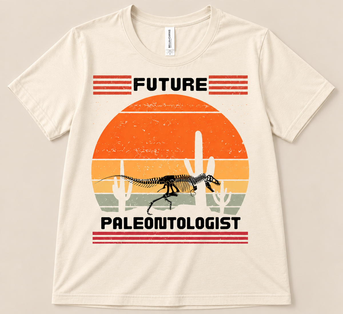Natural Bella Canvas 3001 Future Paleontologist Tee with dinosaur fossil skeleton, retro sunset and desert cactus design
