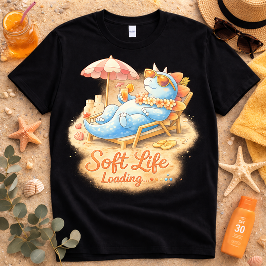 Soft life loading stegosaurus graphic tee on black shirt with glowing beach design and relaxed summer aesthetic
