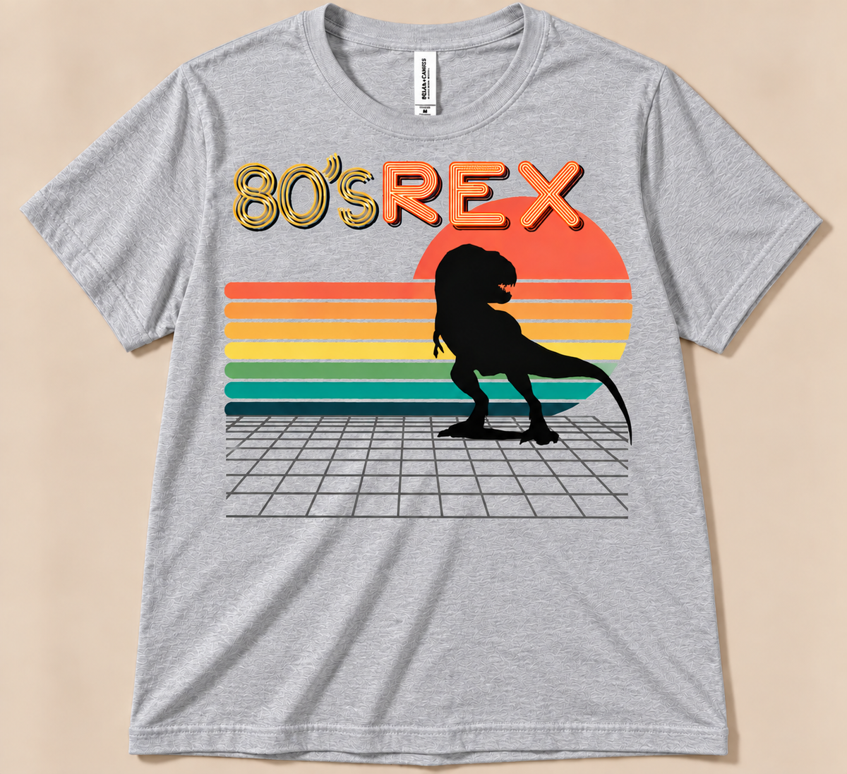 Athletic Heather Bella Canvas 3001 80’s REX Tee with black T-Rex, striped sunset and retro dinosaur design