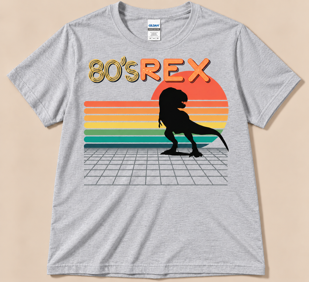Sport Gray Gildan 5000 80’s REX Tee with black T-Rex, striped sunset and retro 80s dinosaur artwork