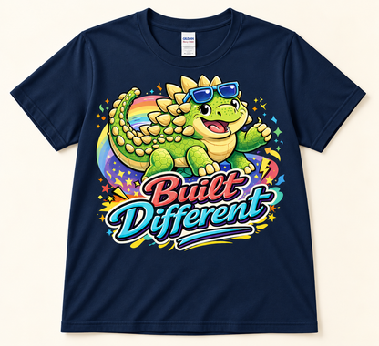 Navy Gildan 5000 Built Different Ankylosaurus graphic tee featuring a green dinosaur in blue sunglasses with rainbow art