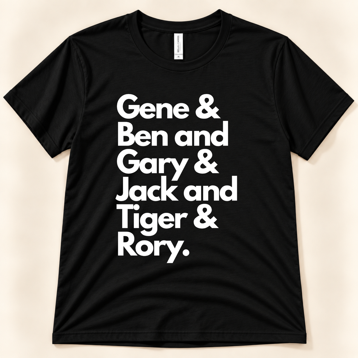 Black Bella Canvas 3001 Career Grand Slam golf shirt featuring white typography honoring Gene Sarazen, Ben Hogan, Gary Player, Jack Nicklaus, Tiger Woods and Rory McIlroy, from New Chapter Tees, a California small business.