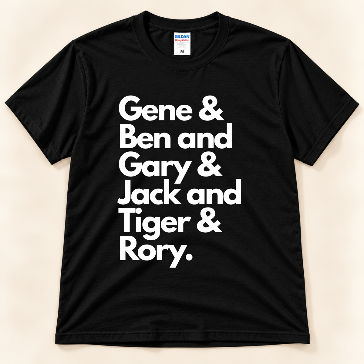 Black Gildan 5000 Career Grand Slam golf graphic shirt featuring white lettering with the names Gene, Ben, Gary, Jack, Tiger and Rory, honoring golf's career Grand Slam champions from New Chapter Tees, a California small business.