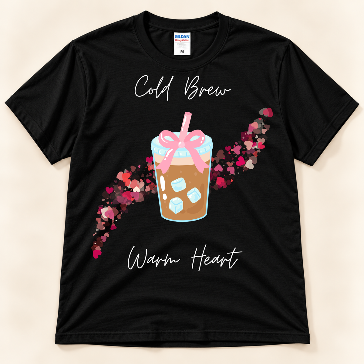 Black Gildan 5000 coffee graphic tee featuring a cute cold brew with pink bow and colorful heart trail.
