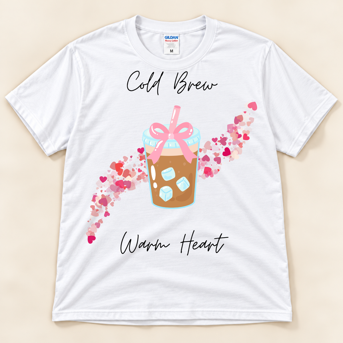 White Gildan 5000 iced coffee shirt featuring a cold brew cup with pink bow and colorful heart design.