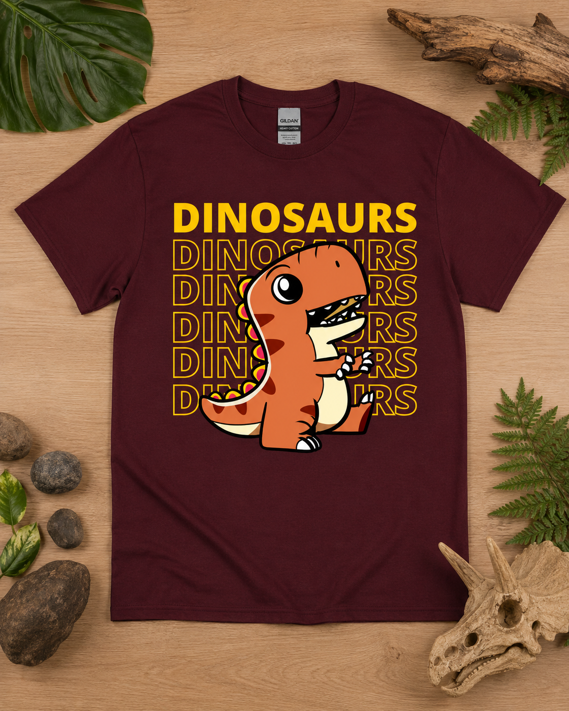 Orange T Rex Dinosaur Energy graphic shirt on a maroon Gildan 5000 heavy cotton tee for adults, kids, and dinosaur lovers.