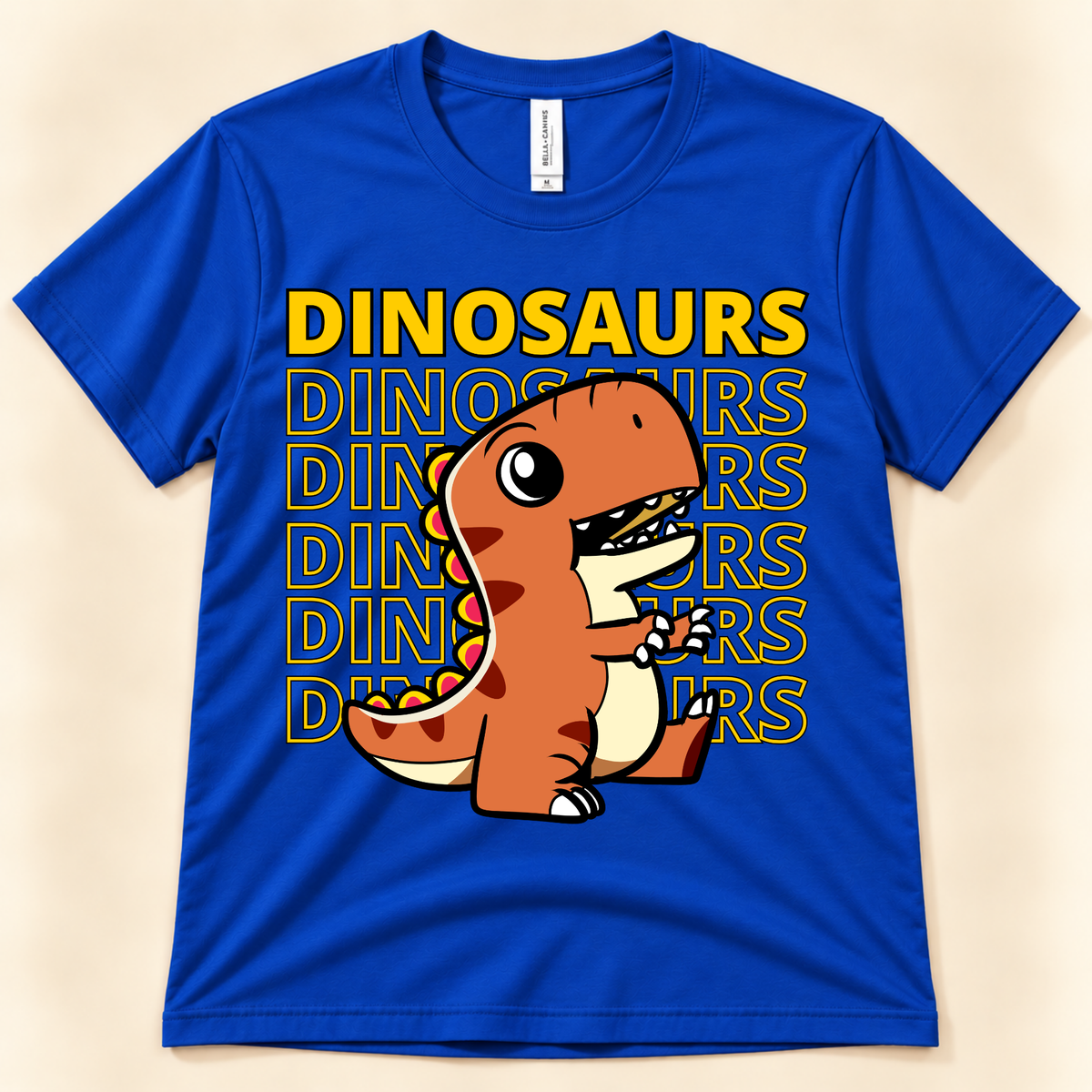 True Royal Bella Canvas 3001 dinosaur shirt featuring a cute orange T Rex with bold Dinosaurs typography for kids, teens and adults.