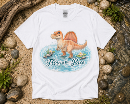 Flow at Your Pace Spinosaurus dinosaur graphic shirt on white Gildan 5000 unisex tee featuring calming river artwork cute dinosaur shirt USA