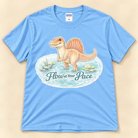 Flow at Your Pace Spinosaurus graphic tee in Carolina Blue featuring a cute dinosaur standing in a peaceful pond from New Chapter Tees, a California small business.