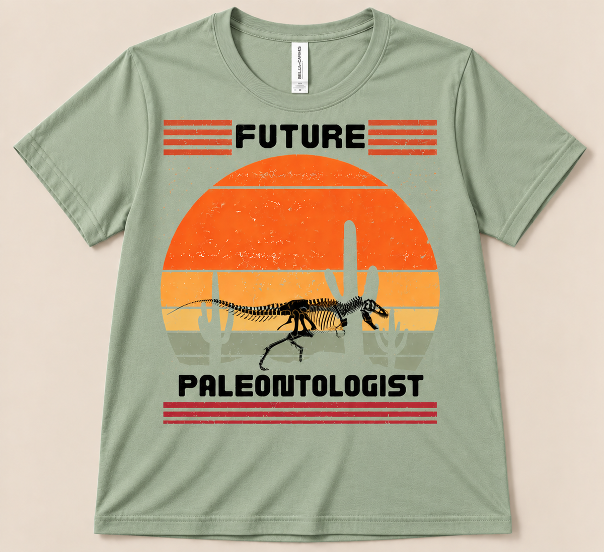 Sage Bella Canvas 3001 Future Paleontologist dinosaur shirt featuring a fossil skeleton and vintage desert sunset