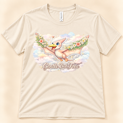 Gentle But Free pterodactyl graphic tee in Natural featuring a cute floral dinosaur flying through pastel clouds from New Chapter Tees, a California small business.