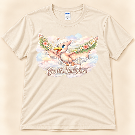 Gentle But Free cute pterodactyl graphic tee in Natural with floral dinosaur artwork and dreamy pastel clouds from New Chapter Tees, a California small business.