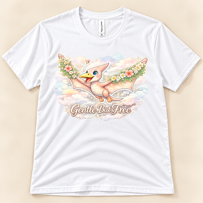 Gentle But Free pterodactyl graphic tee in White featuring a whimsical floral flying dinosaur and pastel clouds from New Chapter Tees, a California small business.