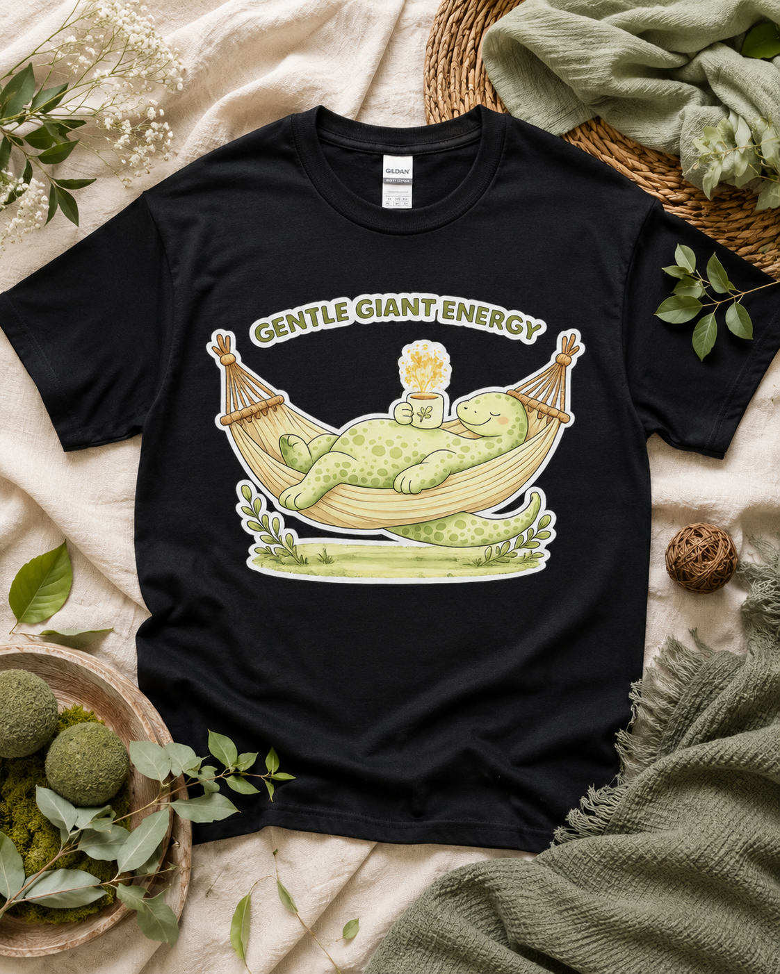 Gentle Giant Energy dinosaur shirt on Black Gildan Heavy Cotton featuring peaceful dinosaur hammock artwork for cozy casual outfits across the USA.