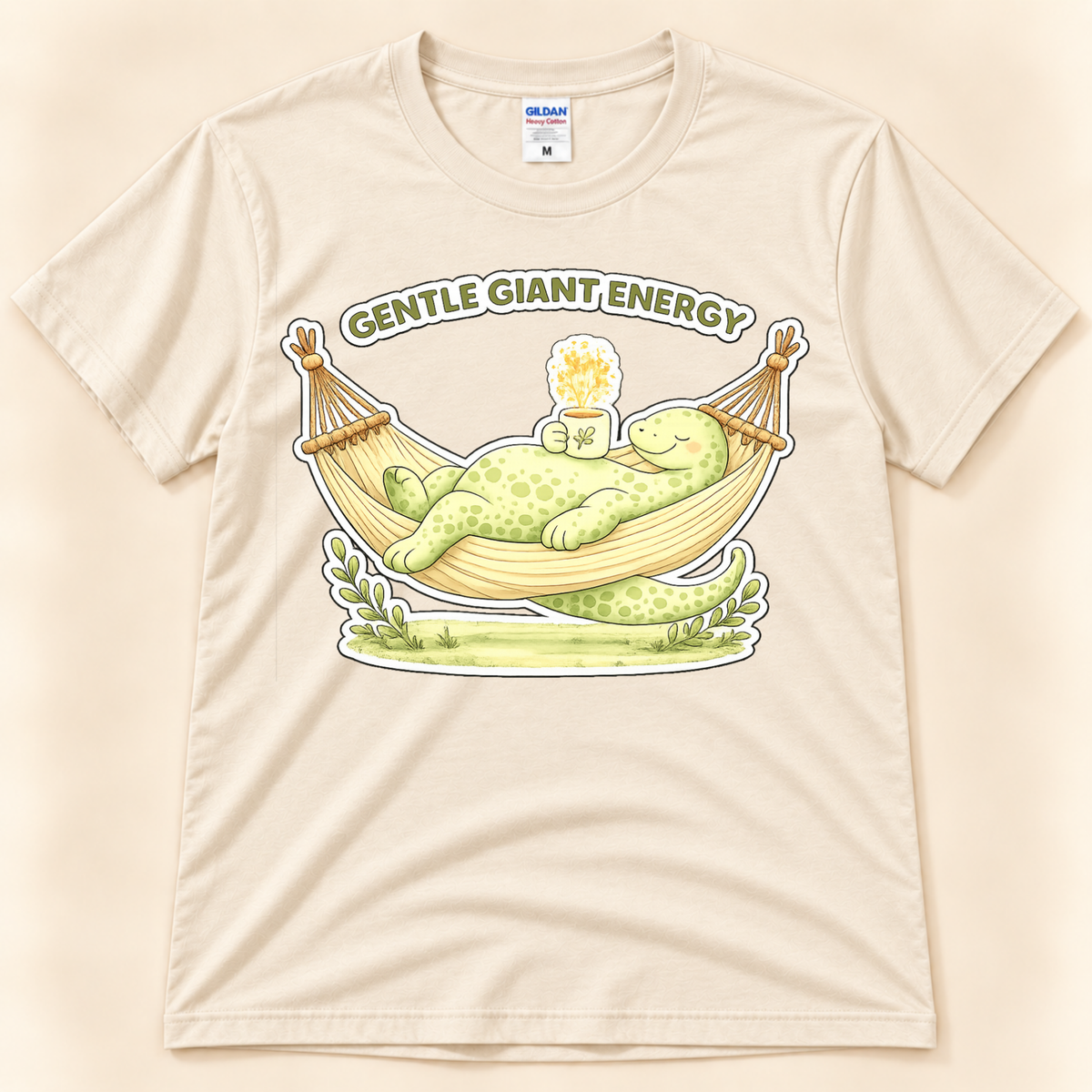 Natural Gildan 5000 Gentle Giant Energy dinosaur graphic tee with a cute brontosaurus resting in a hammock for a relaxed soft life vibe.