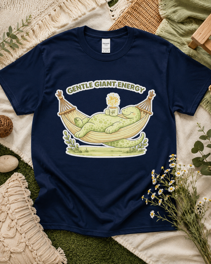 Gentle Giant Energy dinosaur shirt on Navy Gildan Heavy Cotton with relaxing hammock dinosaur graphic for cozy outdoor lifestyle apparel in the USA.