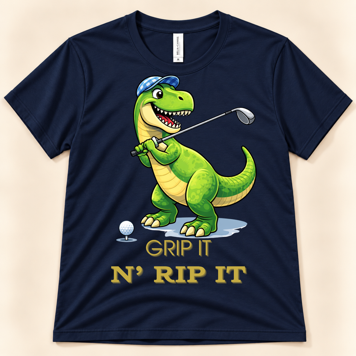 Navy Bella Canvas 3001 T-Rex golf graphic tee featuring a golfing dinosaur with the funny Grip It N Rip It design.