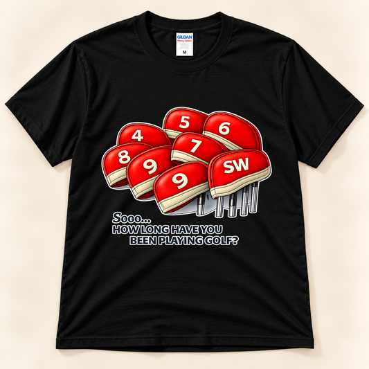 Black Gildan 5000 funny golf tee featuring red numbered iron headcovers and the How Long Have You Been Playing Golf joke from New Chapter Tees, a California small business.