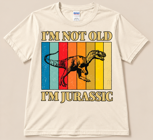 Natural Gildan 5000 I’m Not Old I’m Jurassic Tee with retro rainbow stripes and dinosaur graphic, funny birthday gift shirt