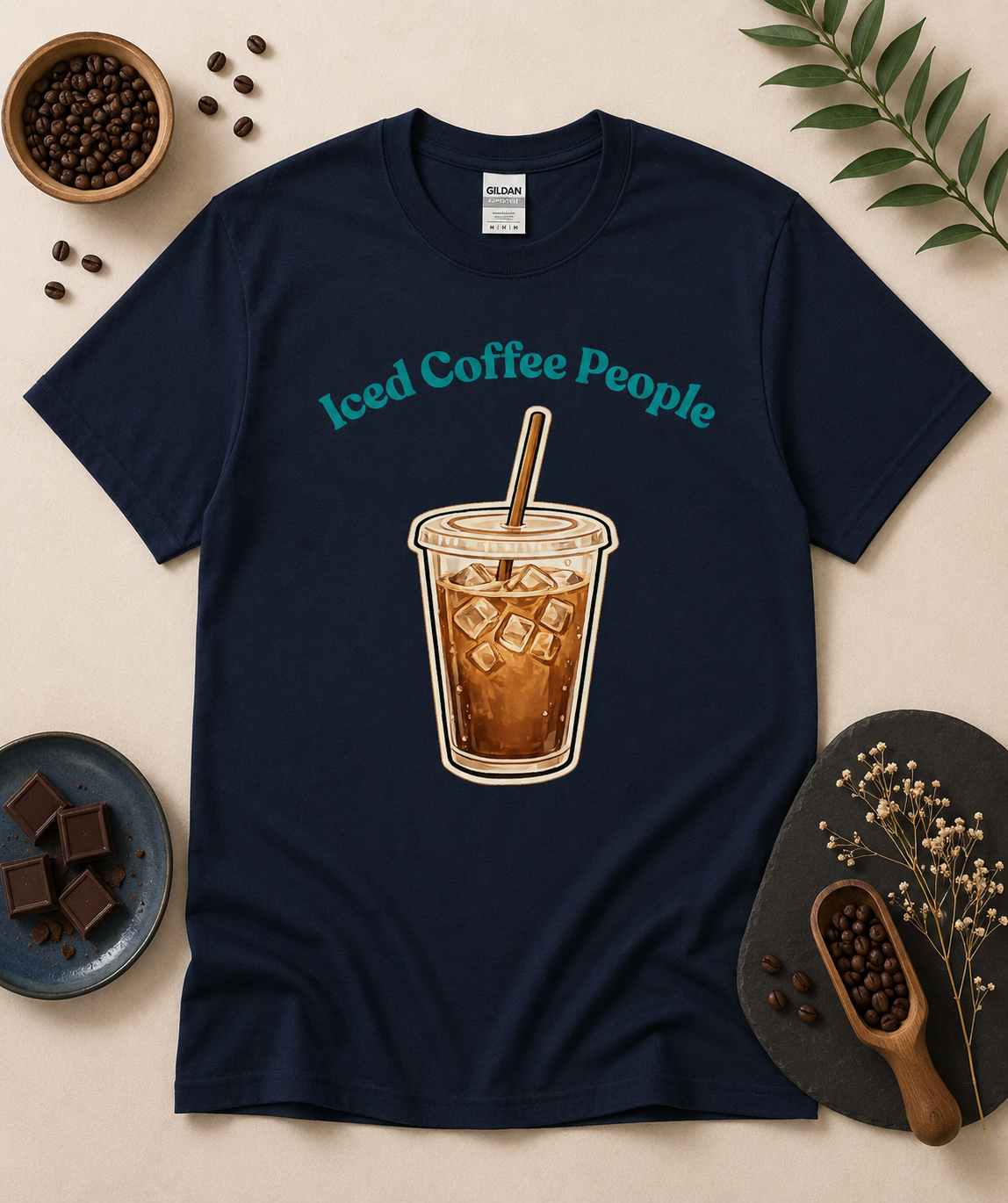 Navy blue Iced Coffee People shirt with iced coffee cup graphic and cozy café inspired flat lay styling