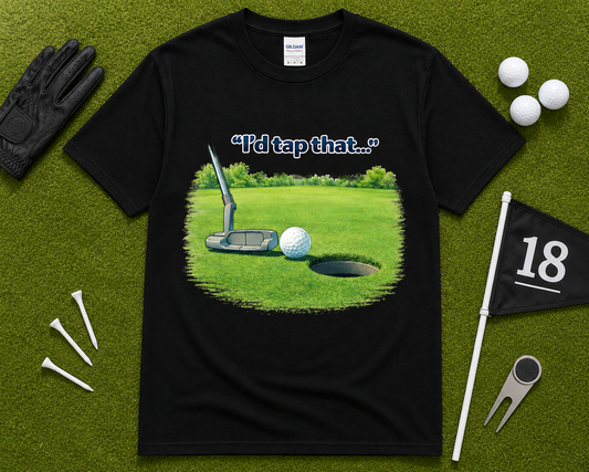 Black golf graphic tee flatlay featuring I'd Tap That putting design on Gildan shirt with golf accessories, funny golfer gift shirt for men and women in the USA.