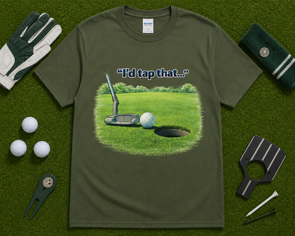 Military green golf graphic tee flatlay featuring I'd Tap That golf design with golf accessories, unique golf gift shirt for players and golf fans in America.