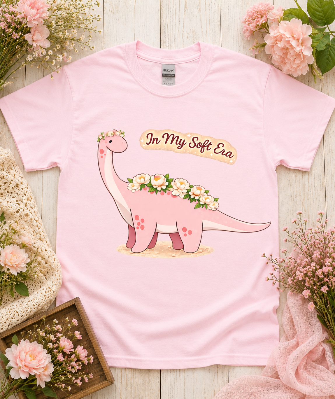 Cute pink dinosaur graphic tee on light pink Gildan 5000 shirt featuring In My Soft Era floral dinosaur design soft aesthetic gift for women girls California