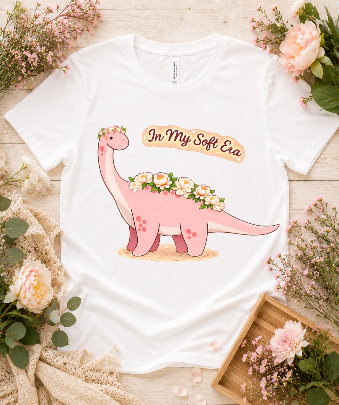Premium Bella Canvas 3001 white soft dinosaur graphic shirt featuring pink floral dinosaur In My Soft Era design cute aesthetic gift for women girls USA