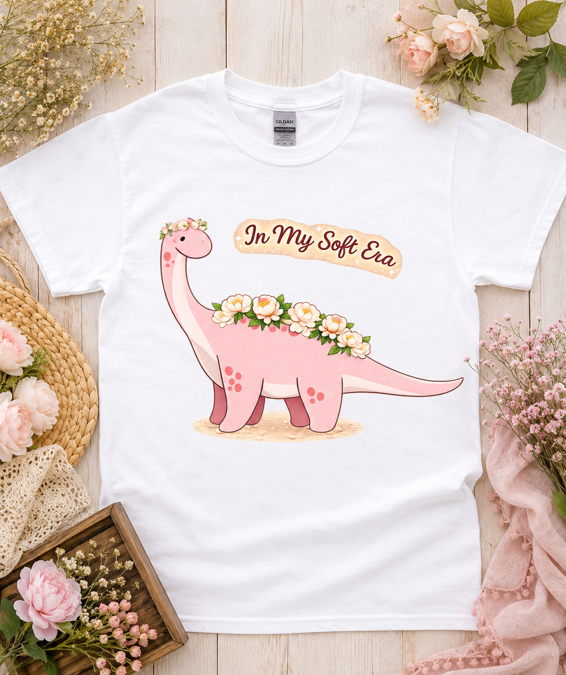 Cute In My Soft Era pink dinosaur graphic tee on white Gildan 5000 shirt with floral flat lay perfect for women girls soft aesthetic dinosaur lovers California USA