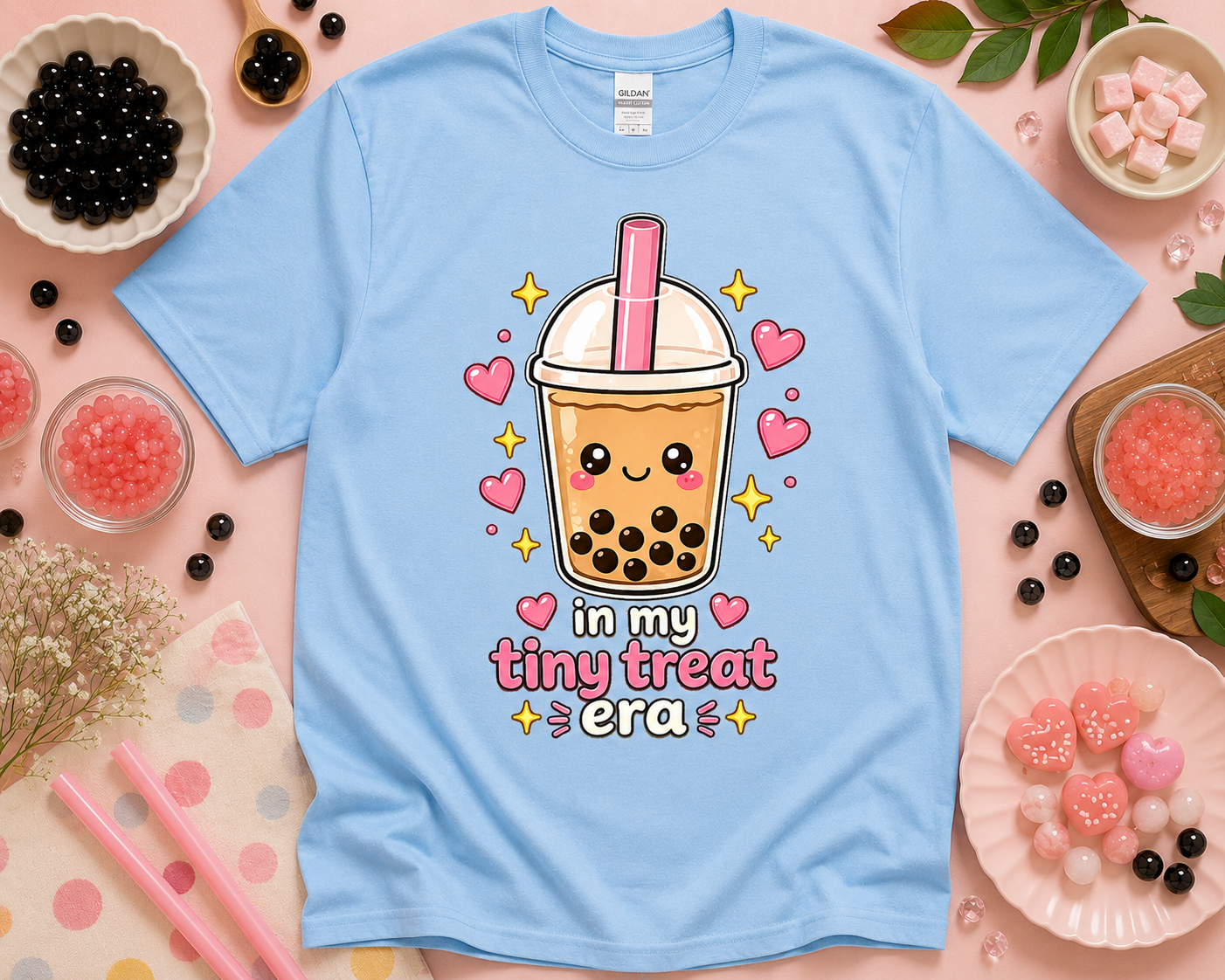 Light blue Gildan 5000 boba graphic tee featuring In My Tiny Treat Era cute bubble tea art in a fun flatlay