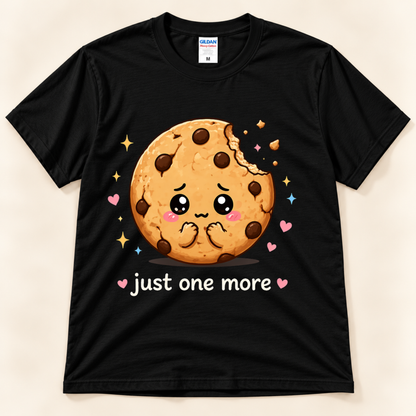 Black Gildan 5000 Just One More Cookie graphic tee featuring a cute kawaii chocolate chip cookie, colorful hearts, sparkles and playful cookie humor from New Chapter Tees, a California small business.