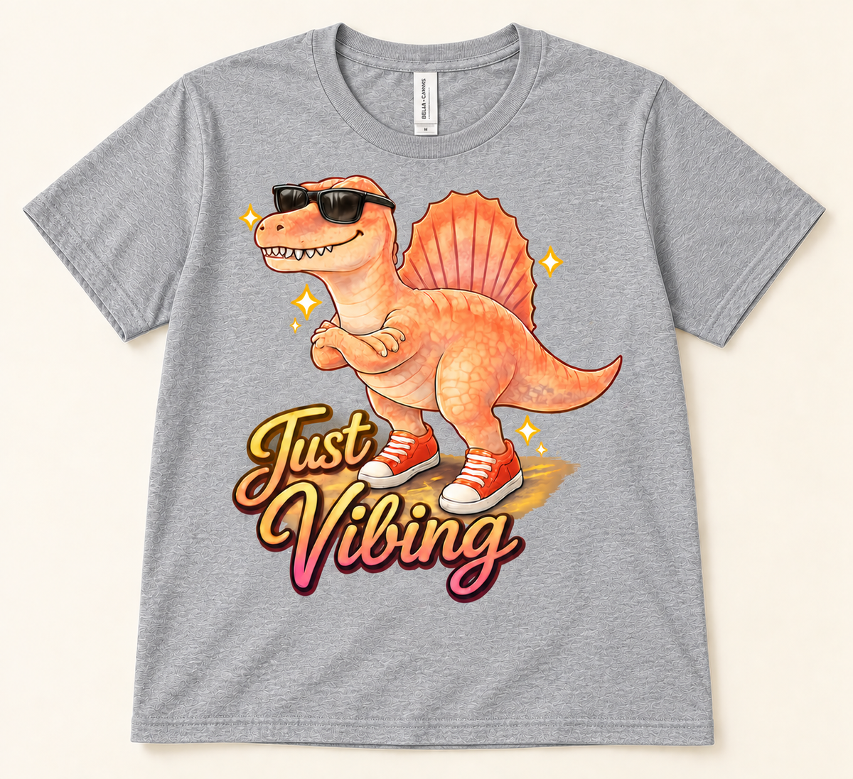 Athletic Heather Bella Canvas 3001 Just Vibing Spinosaurus Tee featuring a funny dinosaur with sunglasses and sneakers