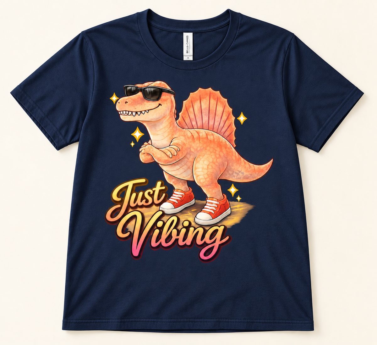 Navy Bella Canvas 3001 Just Vibing Spinosaurus graphic tee featuring a cool dinosaur in sunglasses and red sneakers