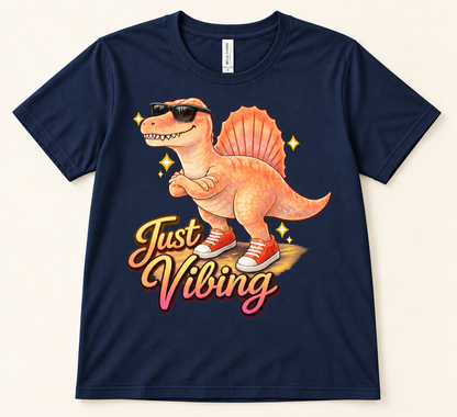 Navy Bella Canvas 3001 Just Vibing Spinosaurus graphic tee featuring a cool dinosaur in sunglasses and red sneakers