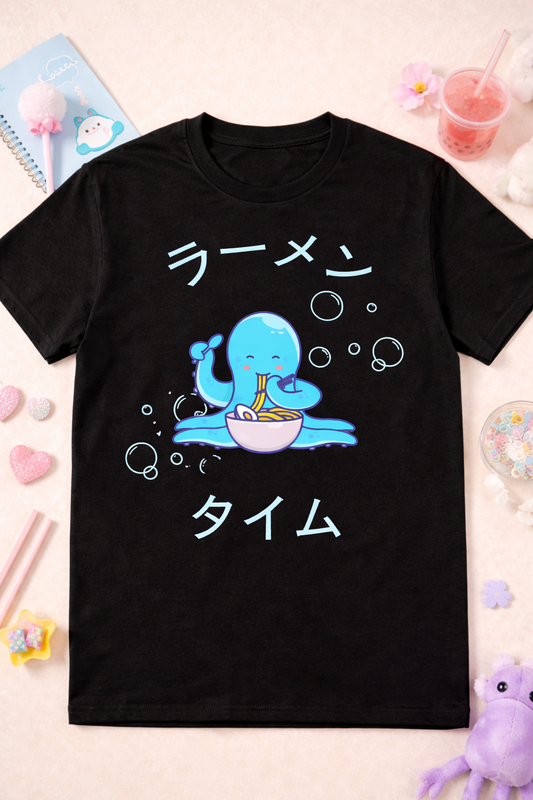 Black kawaii octopus ramen graphic tee with cute anime design and Japanese text, styled with pastel props and playful foodie aesthetic flatlay.