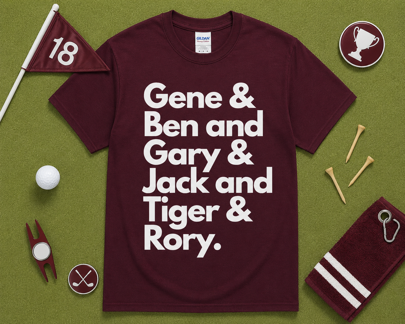 Maroon Gildan 5000 golf graphic t shirt flatlay featuring Gene Ben Gary Jack Tiger Rory design with golf accessories on light green grass, funny golfer gift, unisex golf apparel, USA golf fashion.