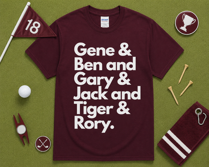 Maroon Gildan 5000 golf graphic t shirt flatlay featuring Gene Ben Gary Jack Tiger Rory design with golf accessories on light green grass, funny golfer gift, unisex golf apparel, USA golf fashion.