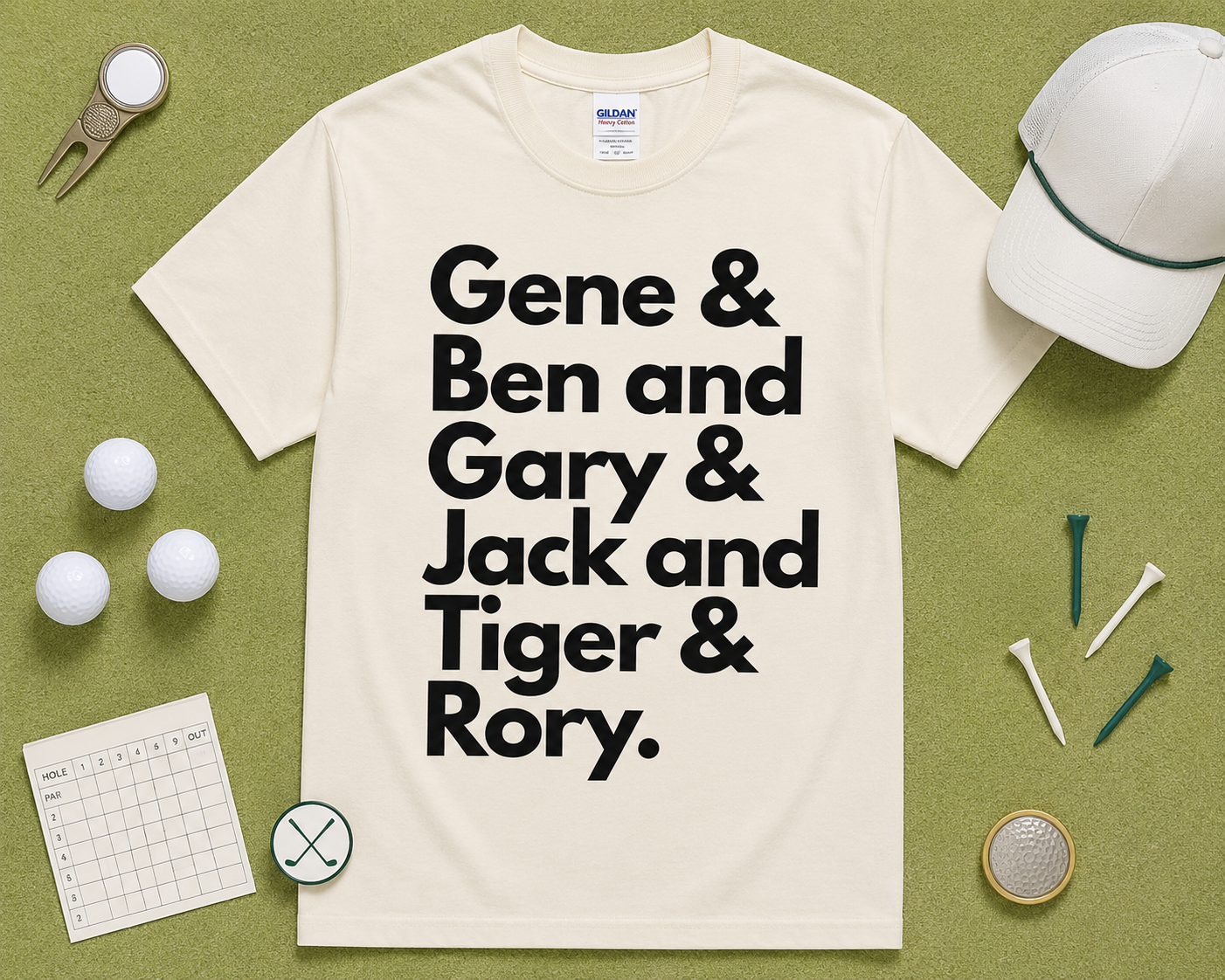 Natural Gildan 5000 golf graphic tee flatlay with Gene Ben Gary Jack Tiger Rory design styled with golf themed accessories on light green grass, funny golf shirt gift, unisex golf apparel made for USA golfers.