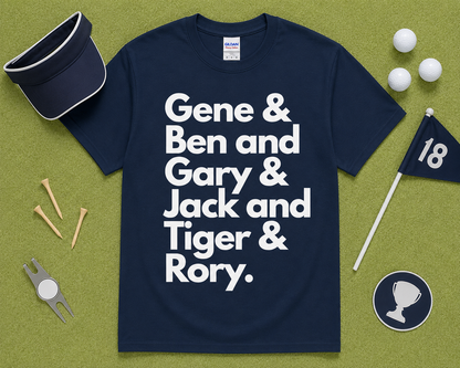 Navy Gildan 5000 golf graphic shirt flatlay featuring Gene Ben Gary Jack Tiger Rory design styled with golf accessories on light green grass, funny golf gift, unisex golfer apparel made for USA golf lovers.