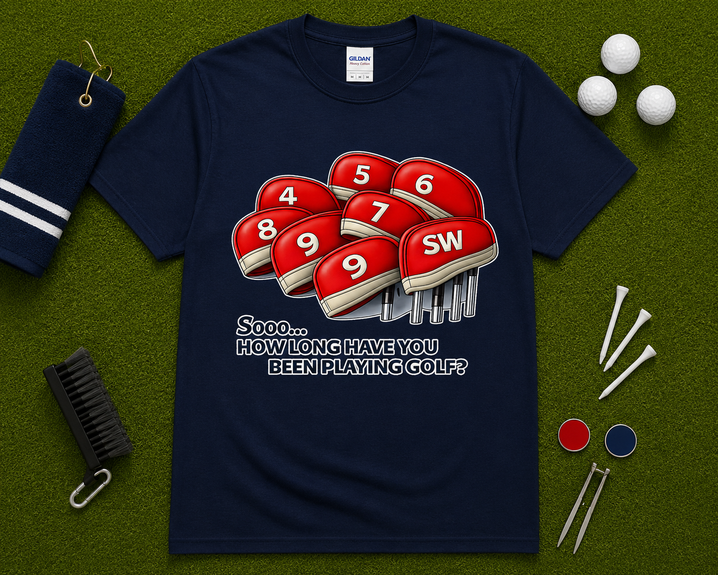 Navy golf graphic tee flatlay showcasing funny How Long Have You Been Playing Golf design with golf club headcovers and golf themed accessories. Popular golf lifestyle shirt for men and women, golf trips, golf tournaments, golf outings, and golf gift occasions nationwide.