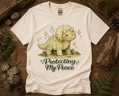 Protecting My Peace cute dinosaur graphic on natural Gildan 5000 unisex t shirt featuring peaceful woodland triceratops artwork