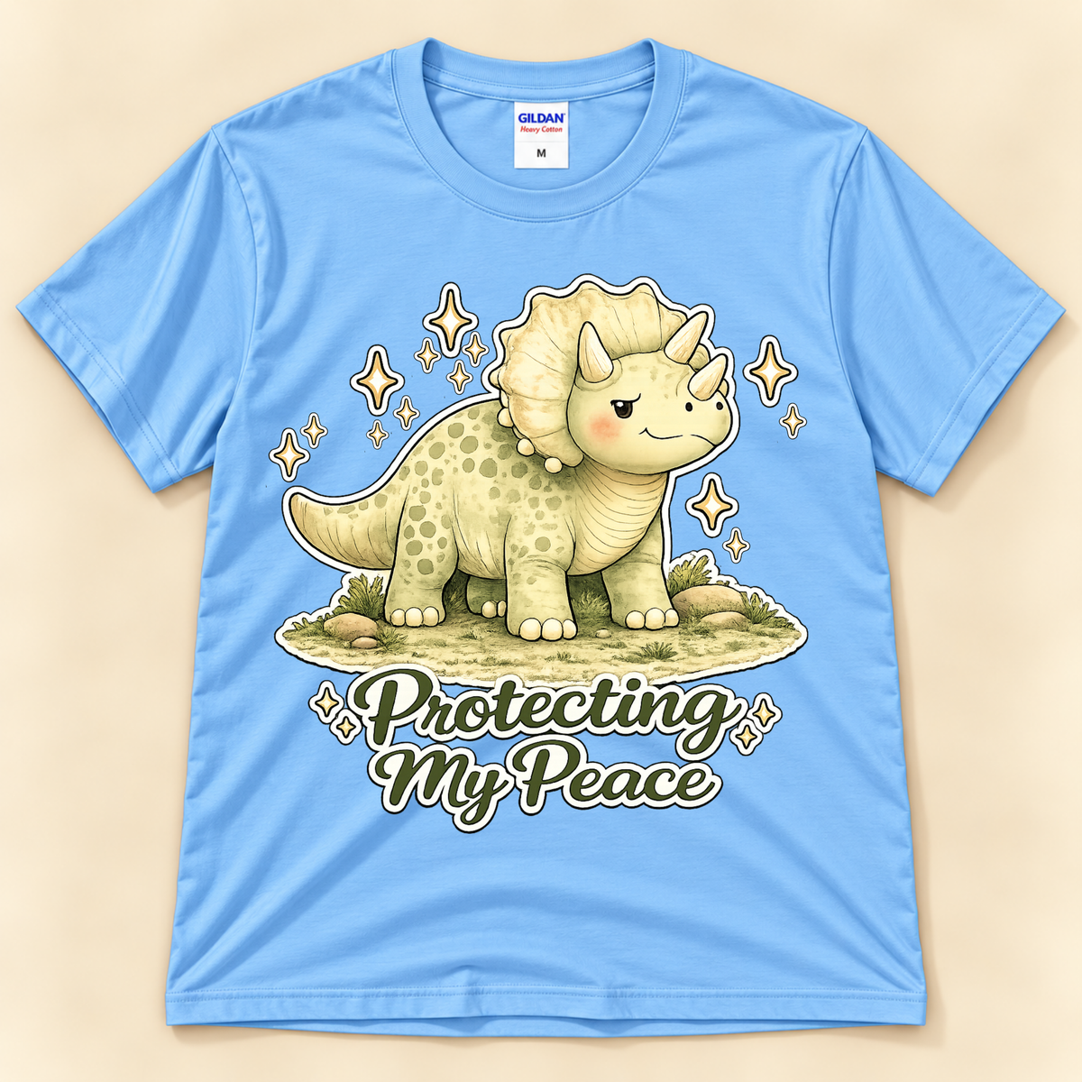 Carolina Blue Gildan 5000 Protecting My Peace graphic tee featuring a cute Triceratops, sparkling accents and positive self care message from New Chapter Tees, a California small business.