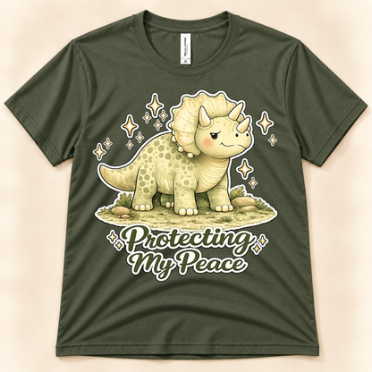 Military Green Bella Canvas 3001 Protecting My Peace dinosaur shirt featuring a cute Triceratops, sparkling accents and peaceful self care message from New Chapter Tees, a California small business.