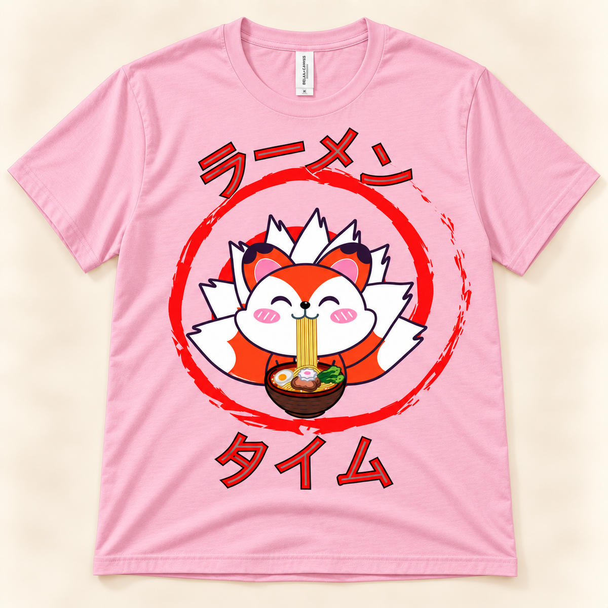 Pink soft graphic tee featuring a cute kawaii fox eating ramen with Japanese Ramen Time artwork.
