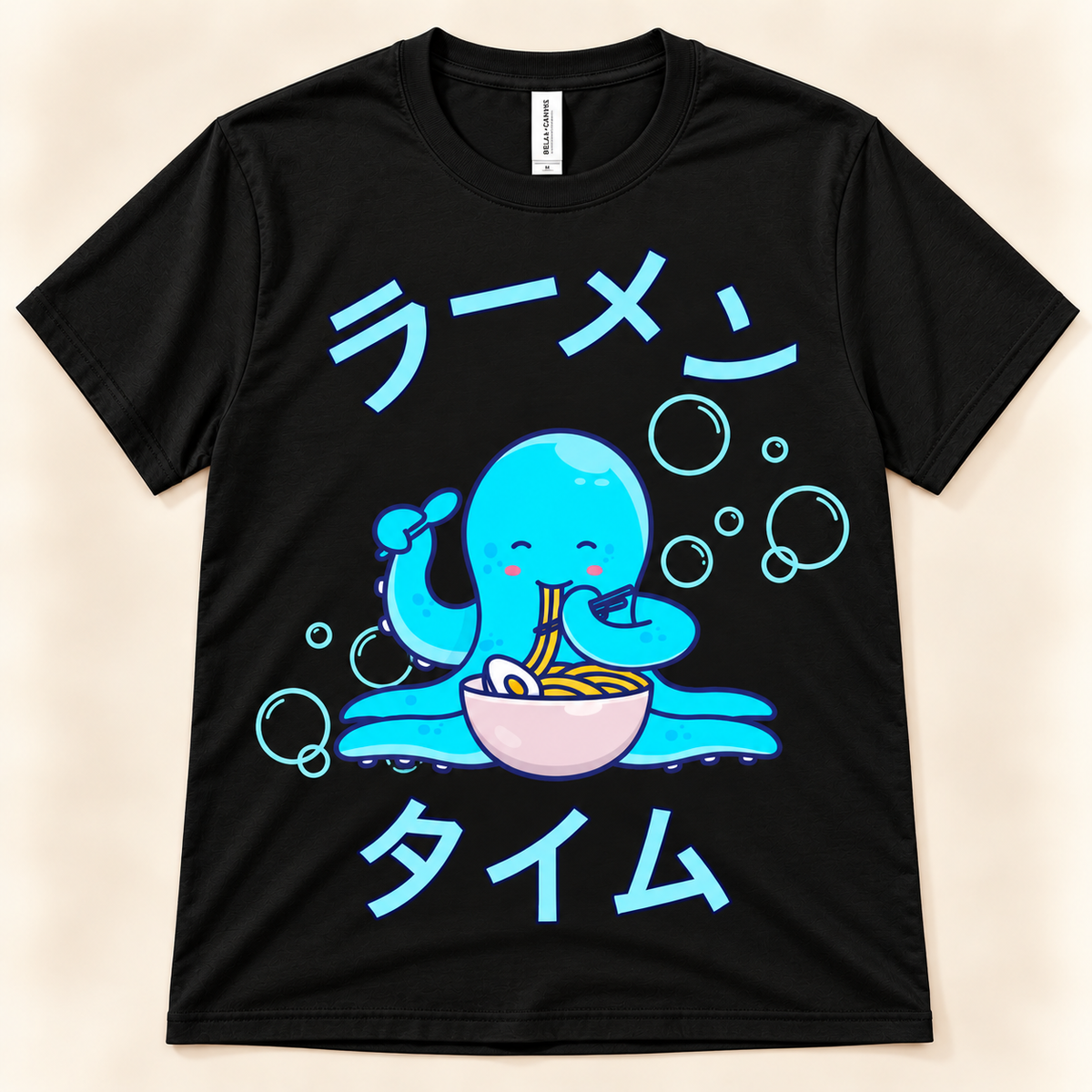 Black soft graphic tee with a kawaii blue octopus eating ramen, bubbles and Japanese Ramen Time artwork.