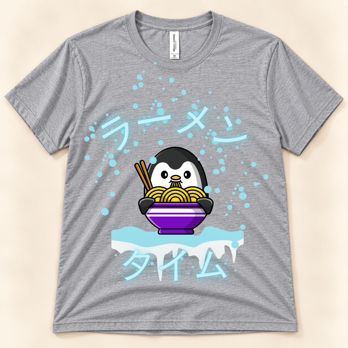 Athletic Heather Bella Canvas 3001 kawaii ramen tee with a cute penguin, noodle bowl, icy details and Japanese Ramen Time design.