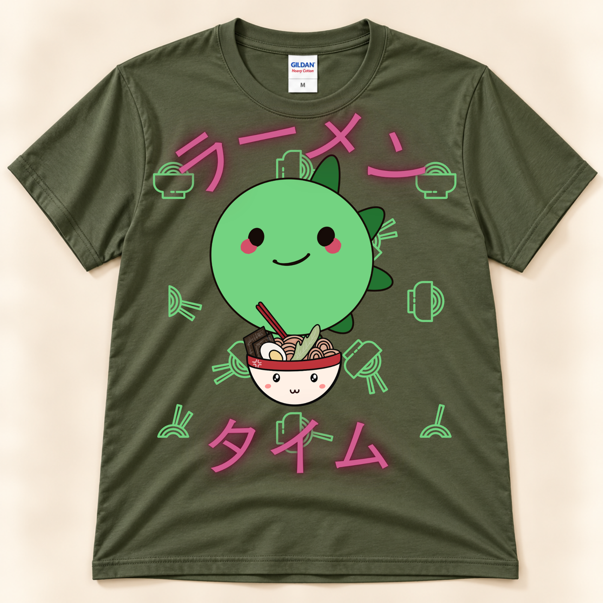 Military Green Gildan 5000 ramen graphic tee featuring a kawaii green stegosaurus, noodle bowl and Japanese Ramen Time artwork.
