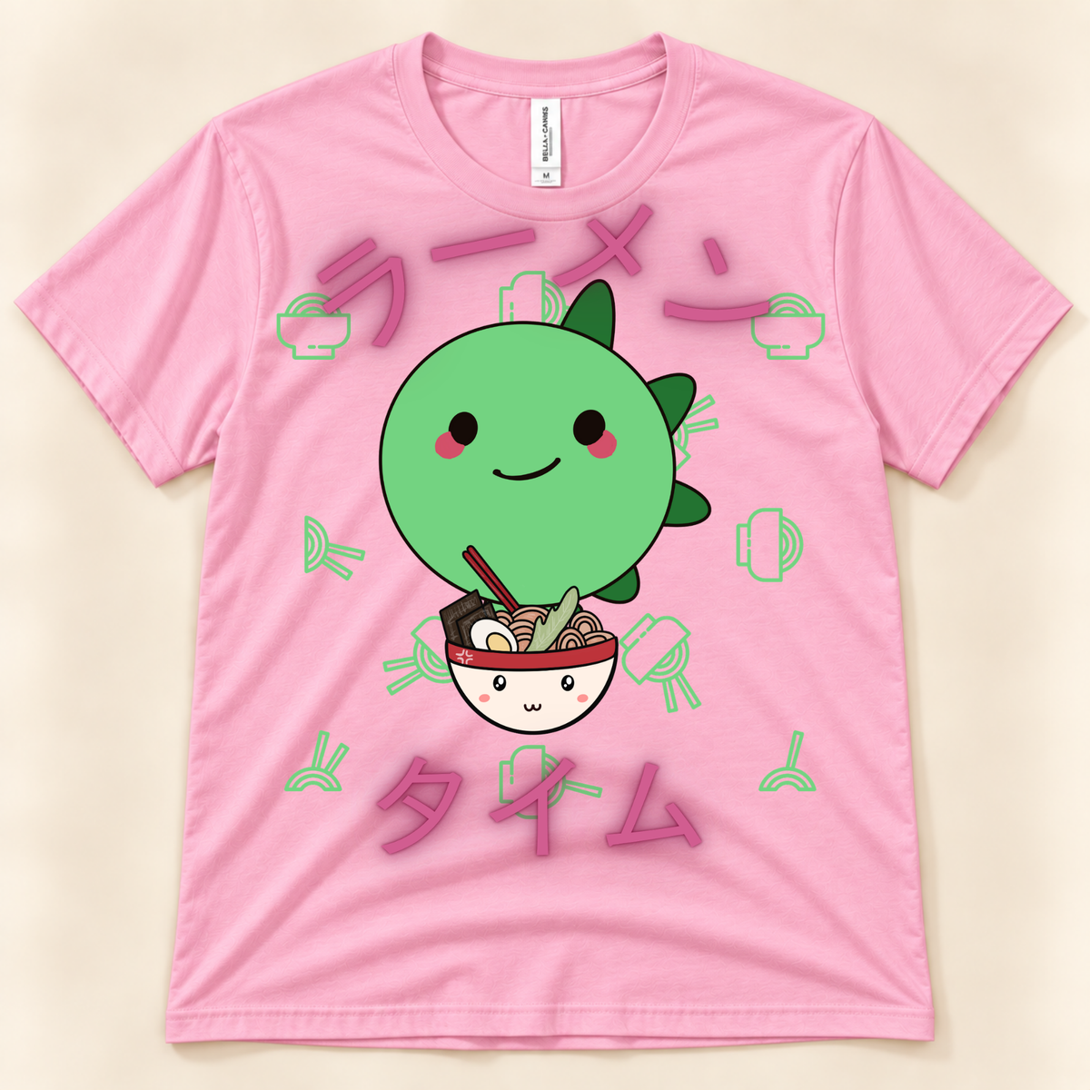 Pink Bella Canvas 3001 kawaii dinosaur ramen shirt with a cute green stegosaurus, noodle bowl and Japanese Ramen Time design.