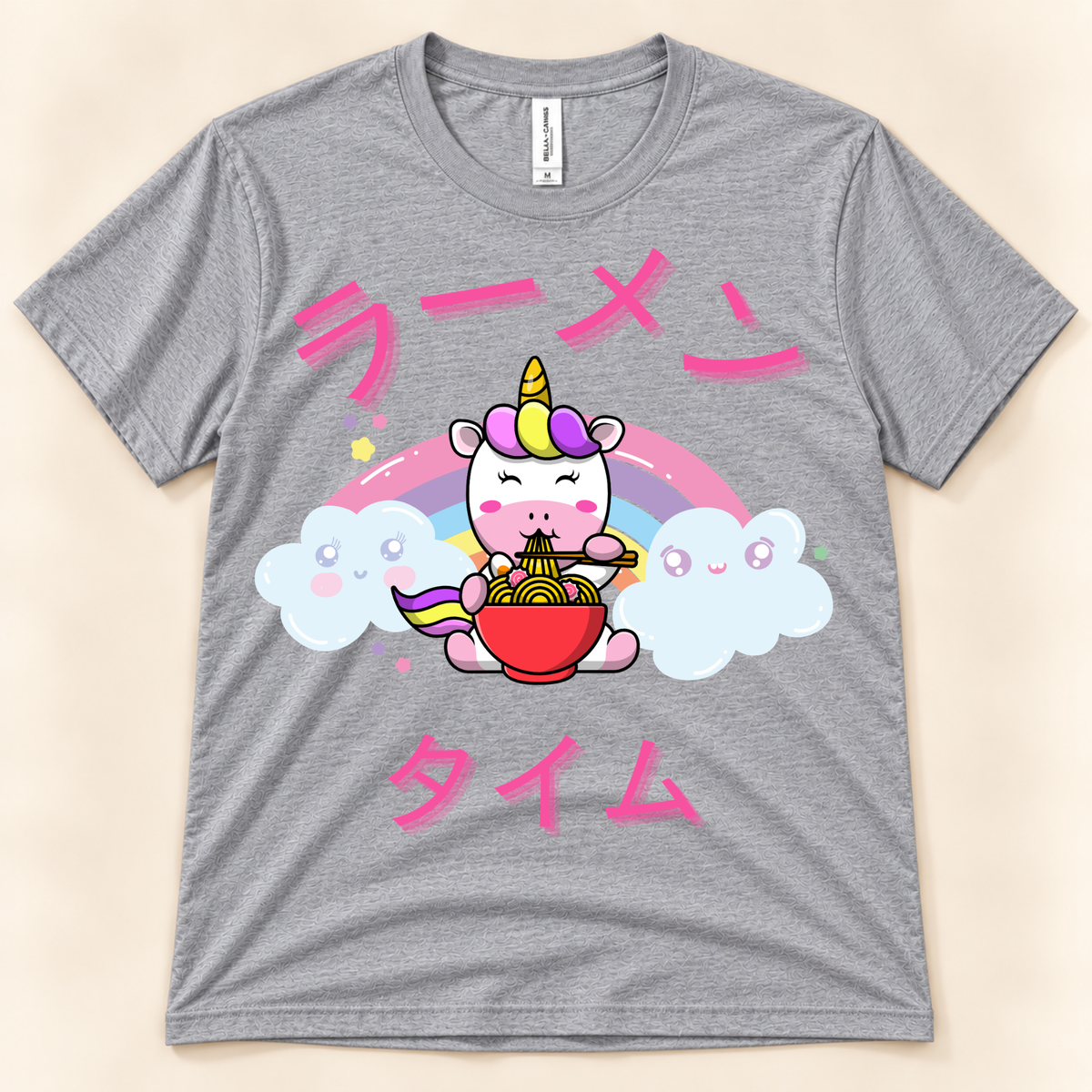 Athletic heather kawaii ramen tee with unicorn eating noodles, rainbow and Japanese lettering.